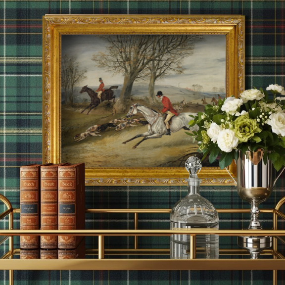 Traditional English country house decor featuring a classic fox hunting scene in a dark wood study.