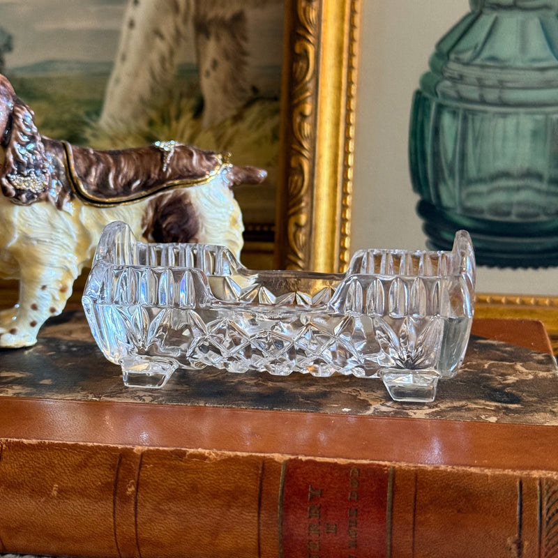 a collection of vintage crystal and dog trinkets, representing items sourced from the last 20 to 99 years