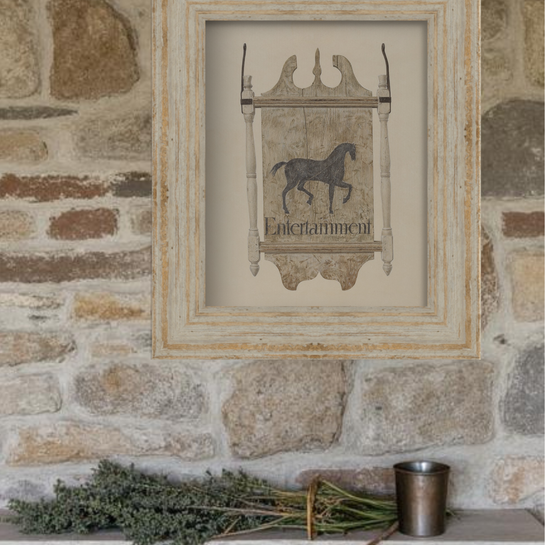 Decorative wall art with a horse illustration and 'Entertainment' text, framed against a stone wall.