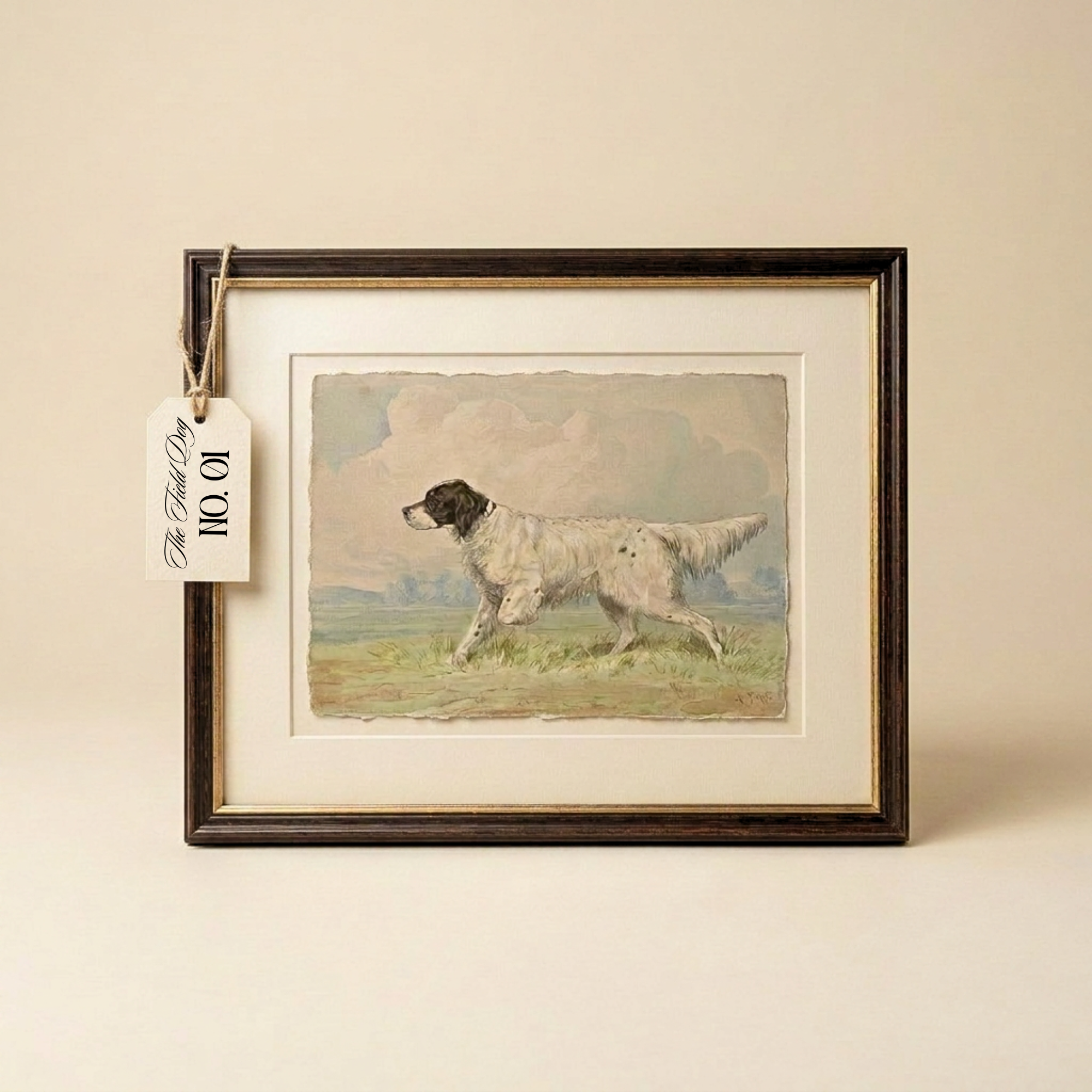 A framed vintage-style print showing a white and black dog running across a grassy field under a cloudy sky, mounted with a wide cream mat and a dark wood frame. A small hanging tag is attached to the left side.