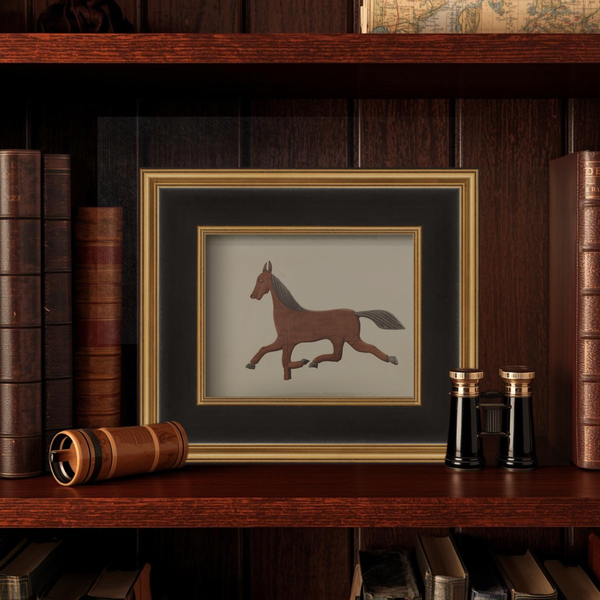 Framed illustration of a horse on a wooden shelf with books and decorative items.