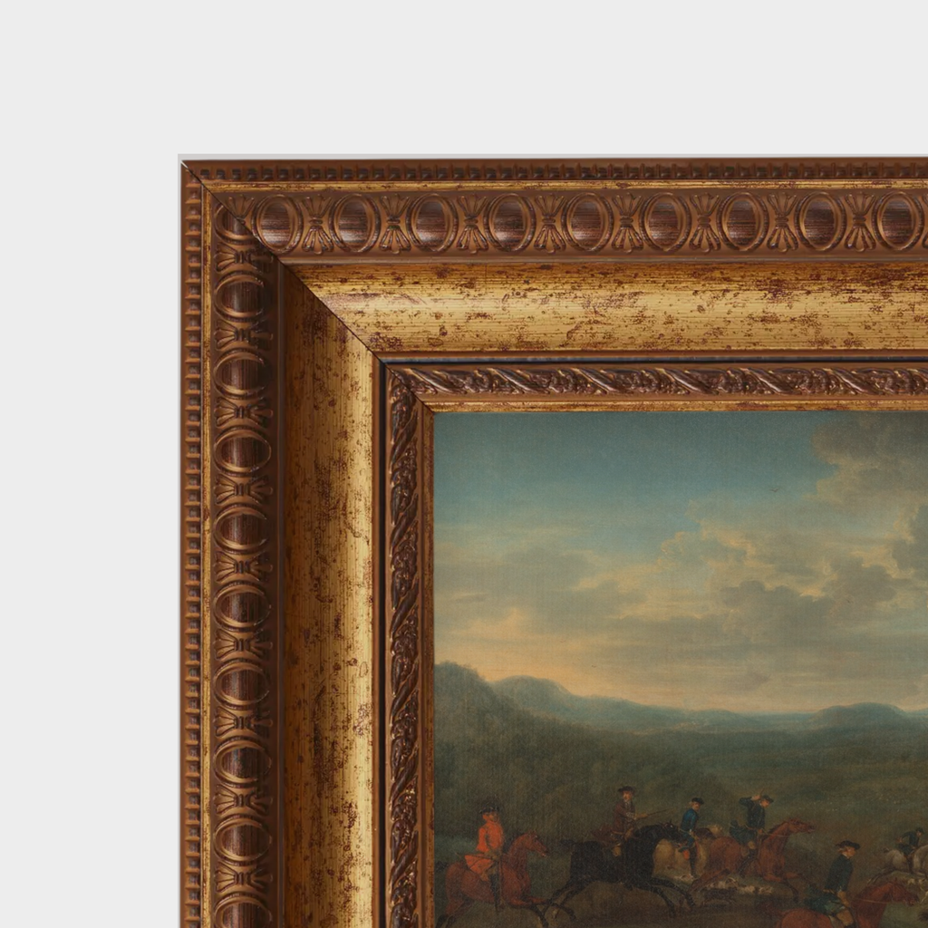 Close-up of the amber-toned gold frame and the fine linen canvas texture of the english hunting scene.