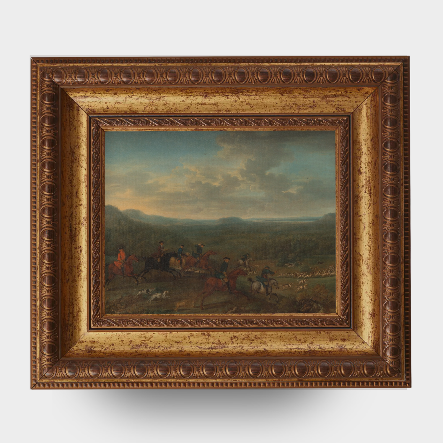 A reproduction of A Fox Hunt by John Wootton in a gold frame on a white background.
