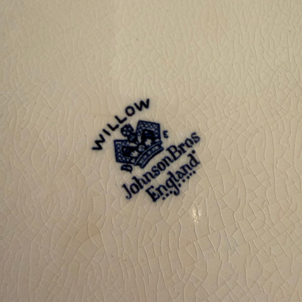 View of the underside of the 12 inch Blue Willow platter showing the glazed of Johnson Bros England