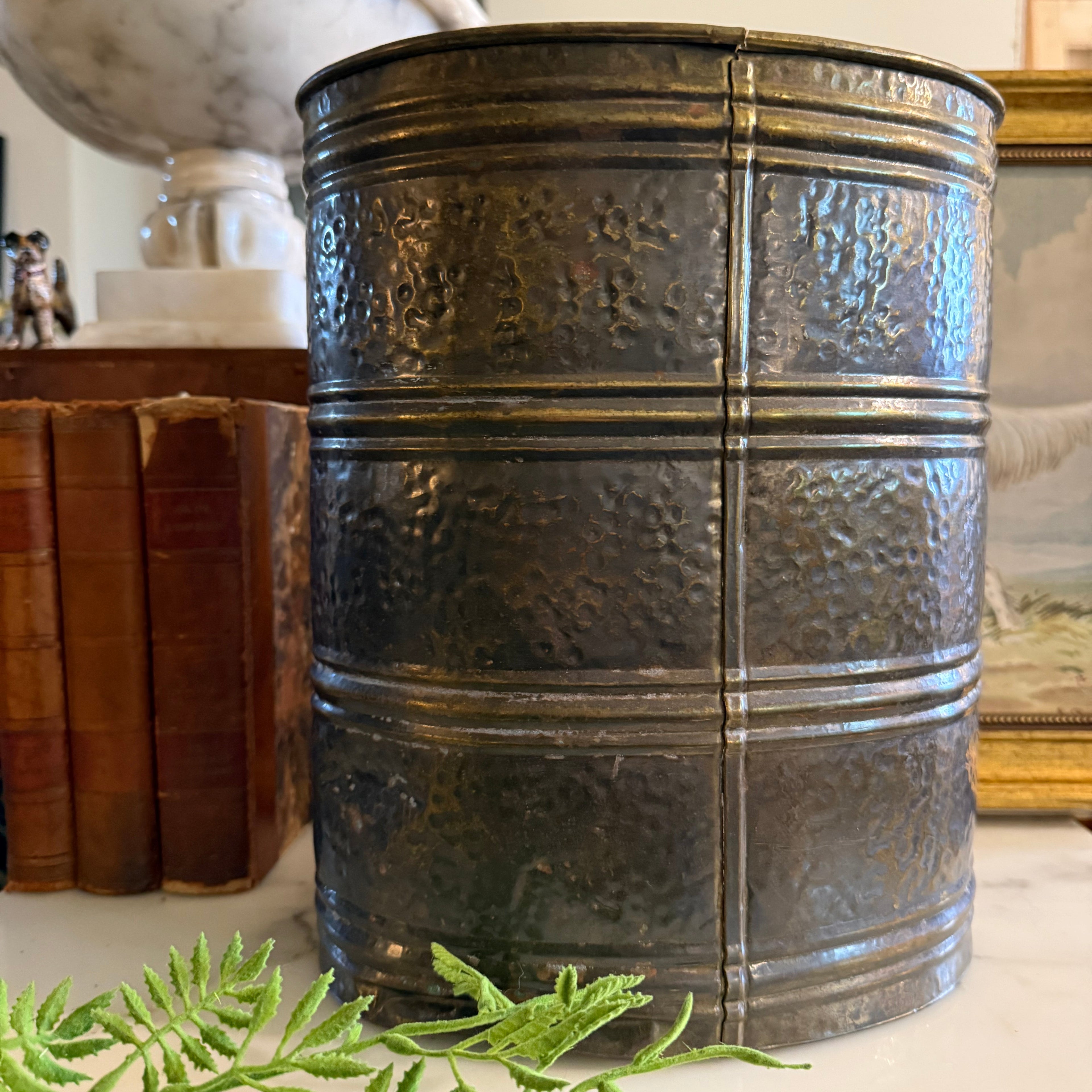 Side profile of the antique brass holder showing the aged patina and cylindrical shape