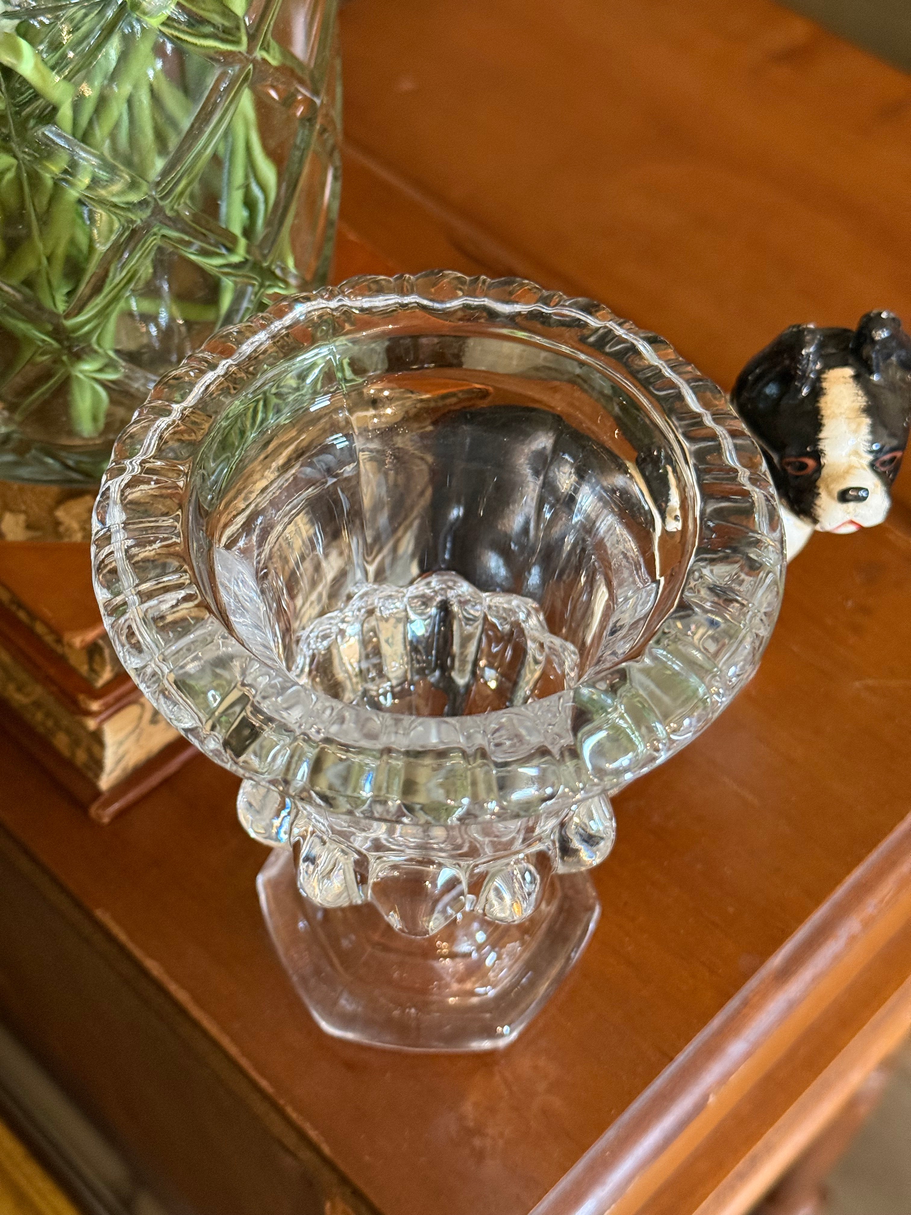 Top-down view looking into the flared rim of the faceted crystal urn vase, showing the clear glass quality.