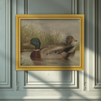 A framed vintage-style painting of two ducks in shallow water with reeds, hung on a paneled wall. The frame is gold-toned, and the wall behind is a muted blue-gray with soft diagonal shadows across it.