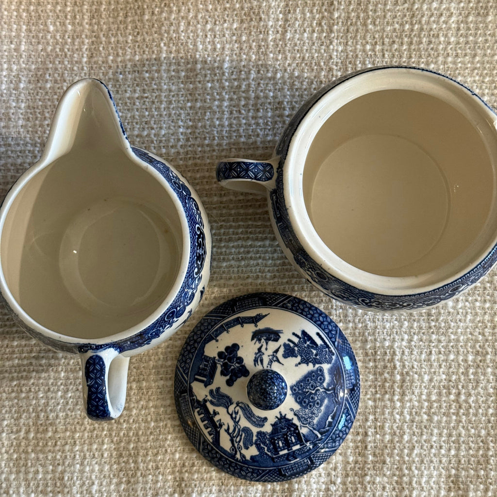 Matching set of Johnson Bros Blue Willow creamer and lidded sugar bowl in top view