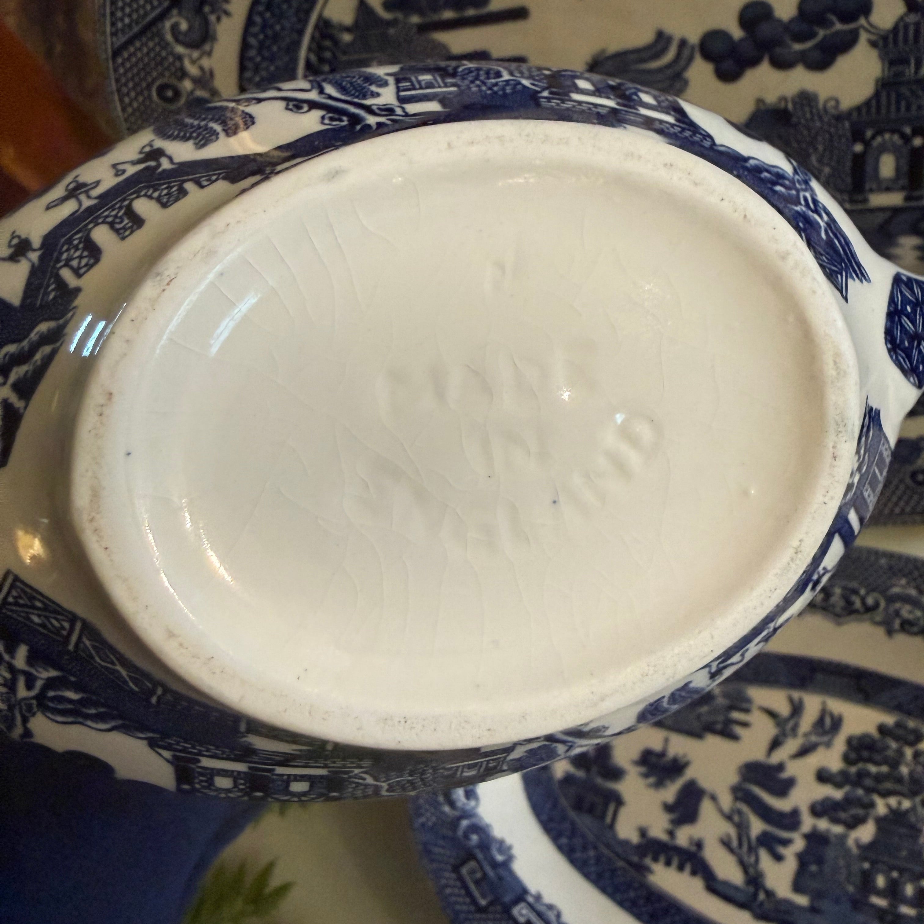 Close-up of a blue and white Made in England ceramic dish with intricate patterns.
