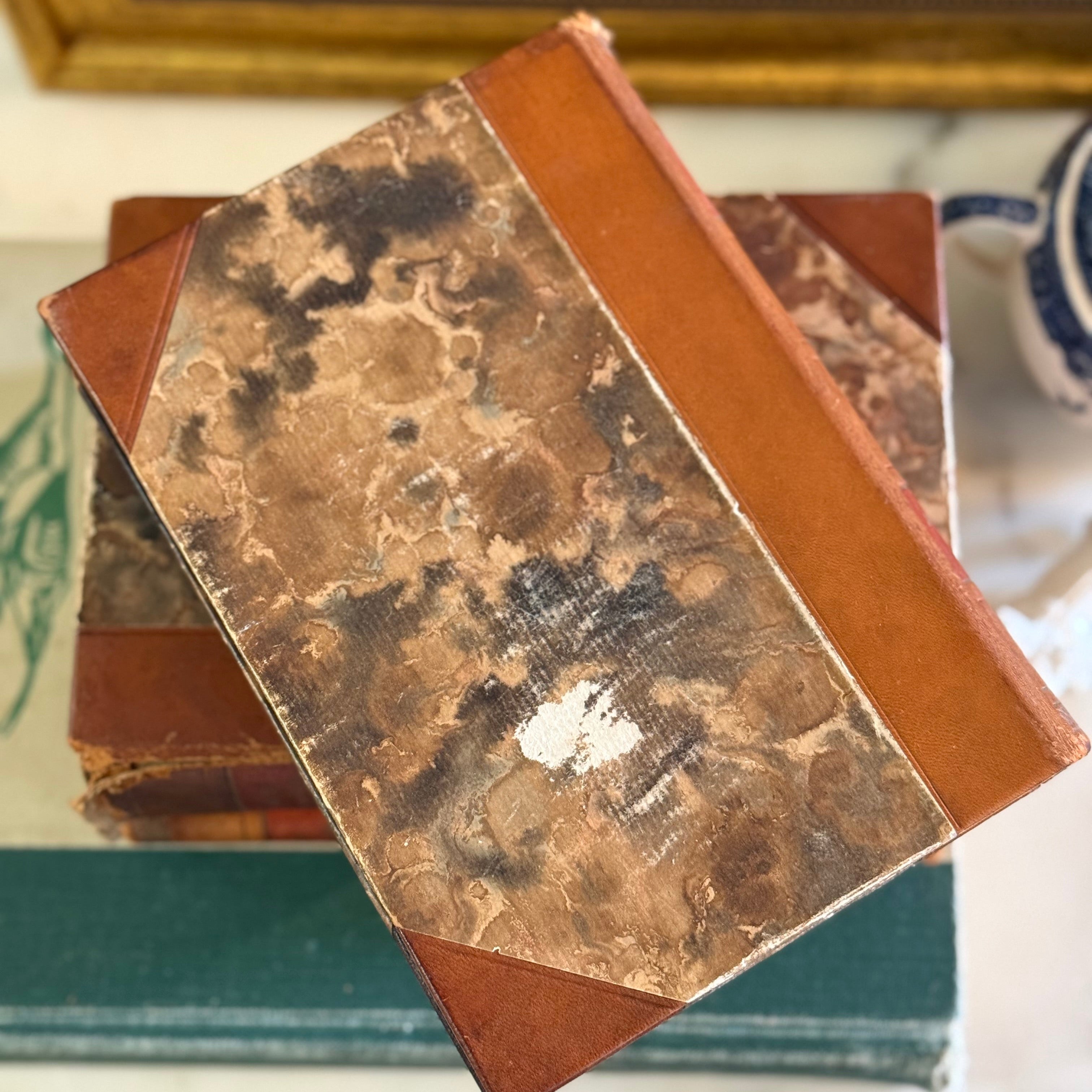 Close up of the brown and tan marbled paper pattern on the book covers