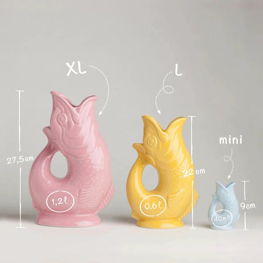 A size comparison chart of three authentic ceramic Gluggle Jugs in Pink (Extra Large, 1.2L, 27.5cm), Yellow (Large, 0.6L, 22cm), and Light Blue (Mini, 40ml, 9cm) with white dimension markings on a gray background.