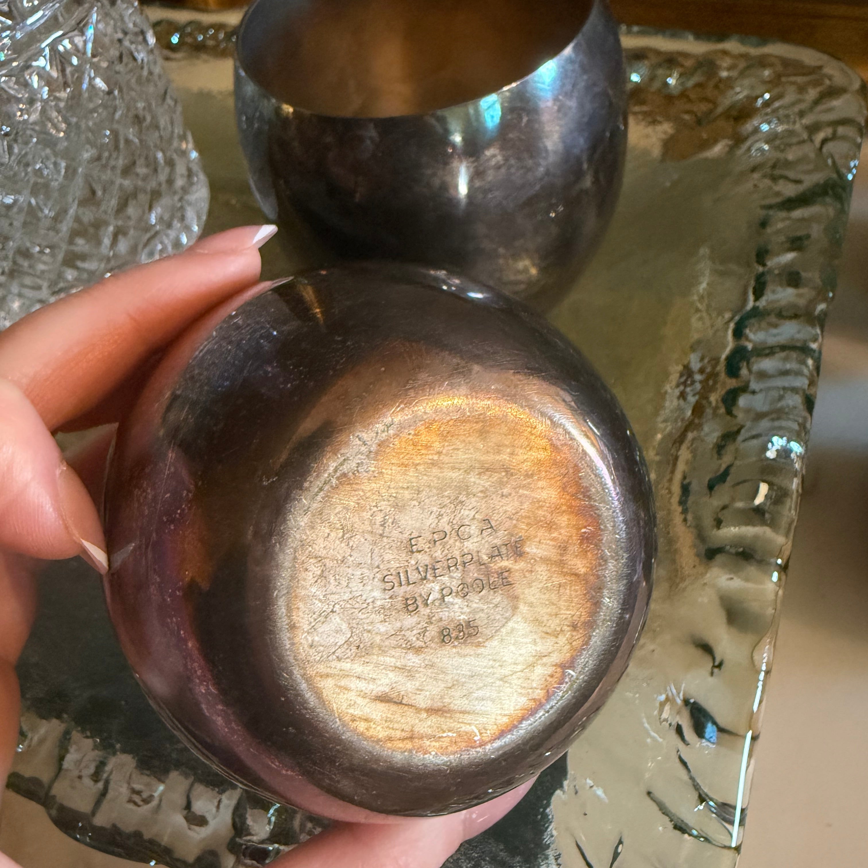 Close up of the Poole EPCA hallmark stamp on the bottom of a silver goblet.