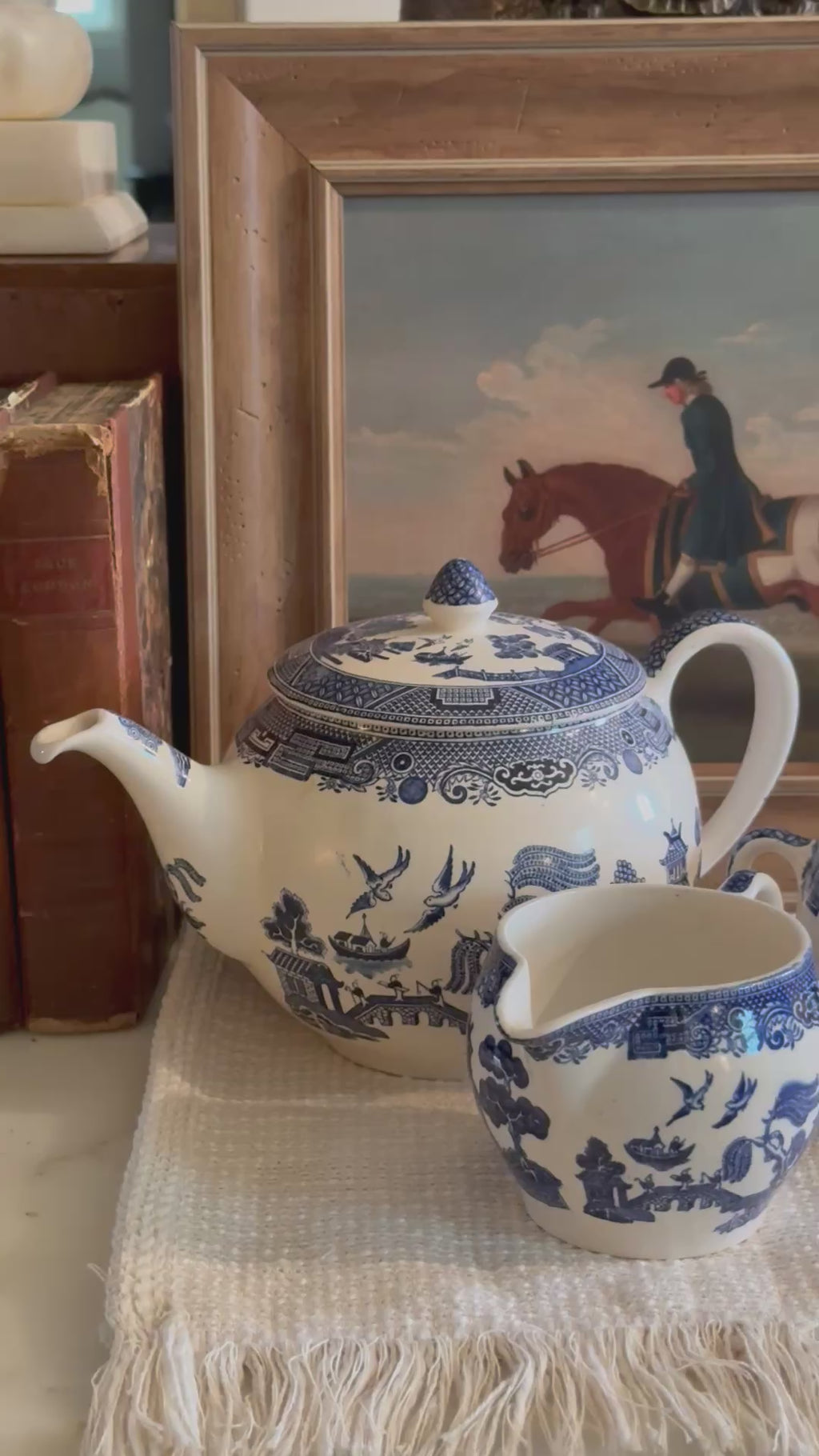 Detail view of the cobalt blue transferware pattern on a vintage English teapot.