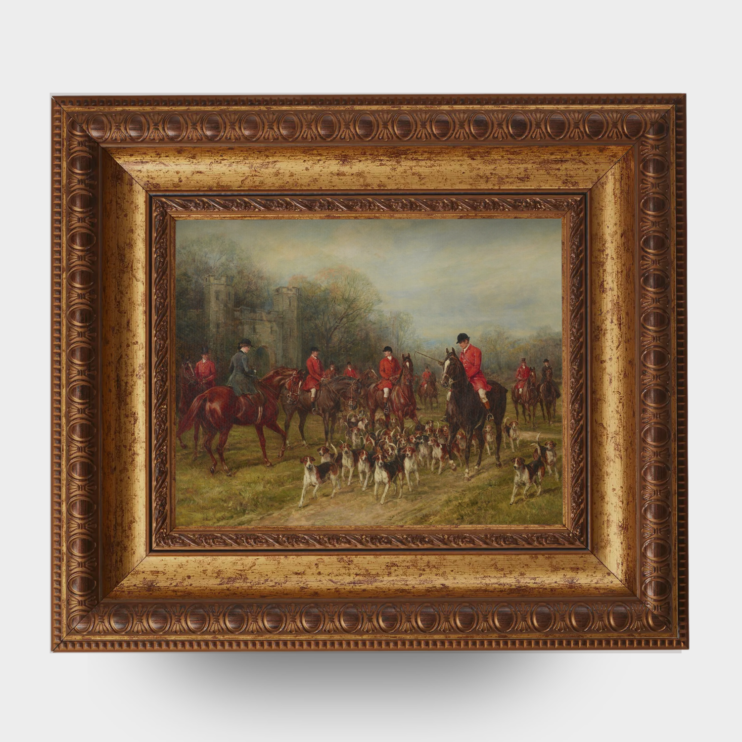 Framed painting of an English hunting scene with people on horseback and dogs in a field.