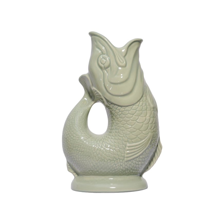 An authentic Extra Large Sage Green ceramic fish-shaped Gluggle Jug pitcher, standing on a clean white background.