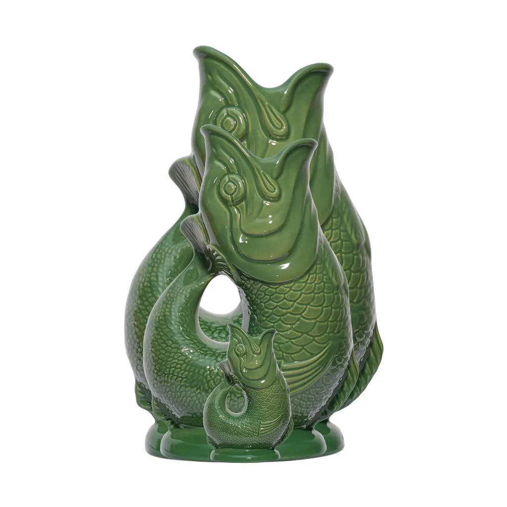 Three classic green ceramic fish-shaped Gluggle Jugs arranged by size—Mini, Large, and Extra-Large—showcasing the iconic British design.