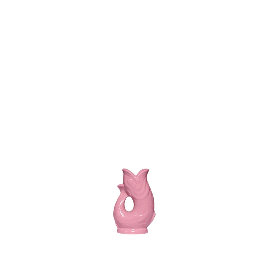 An authentic Mini Pink ceramic fish-shaped Gluggle Jug pitcher, standing on a clean white background.