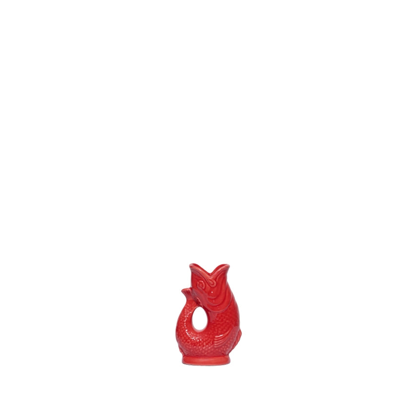 An authentic Mini Red ceramic fish-shaped Gluggle Jug pitcher, standing on a clean white background.