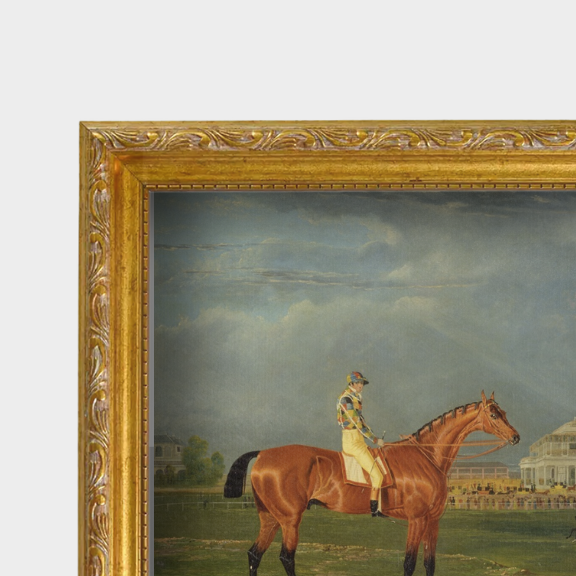 Close-up shot of the aged gold frame and fine art linen texture of the Memnon horse portrait.