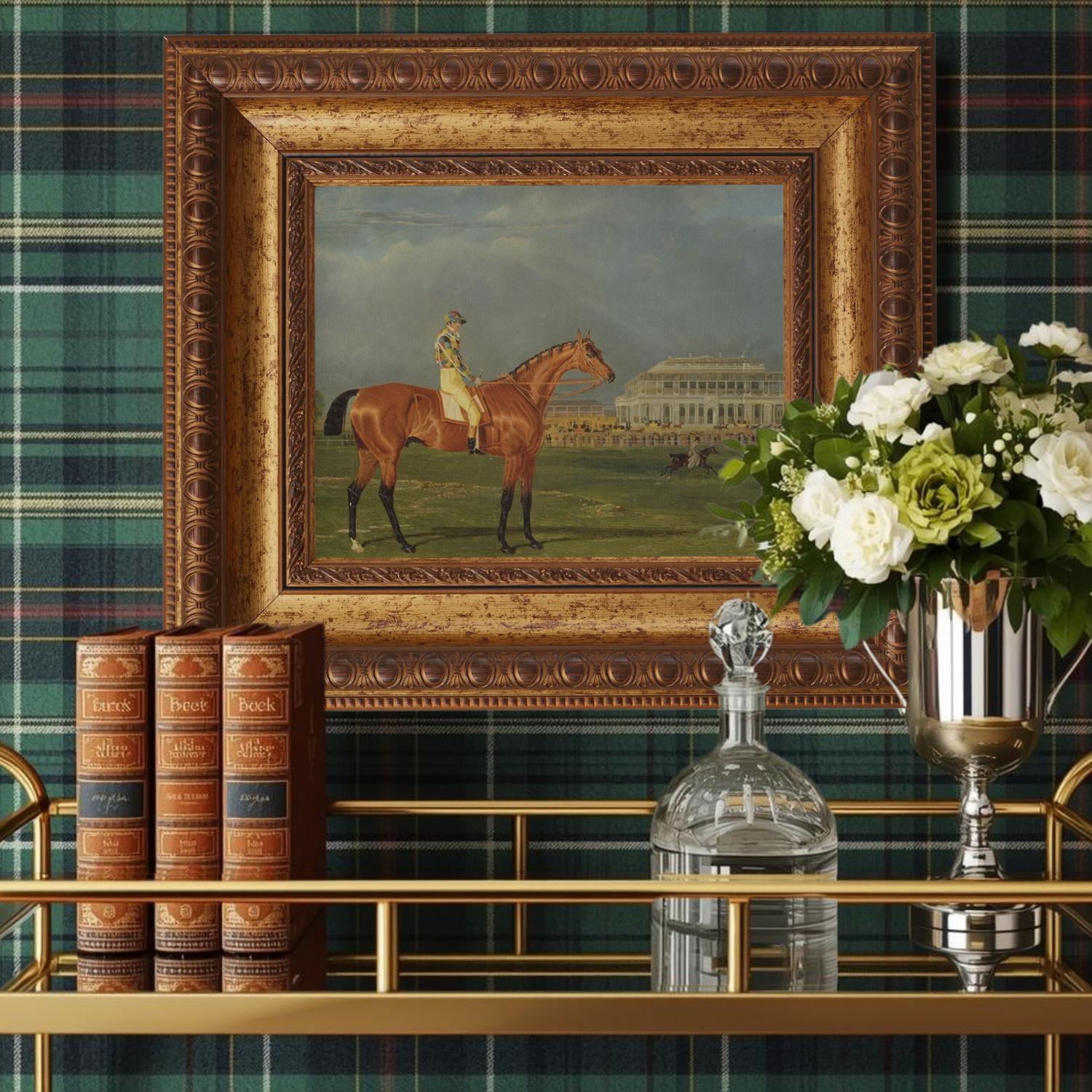 Decorative interior setting with a framed painting of a horse, books, and flowers against a plaid wall.