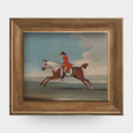 A chestnut racehorse art print in a natural English pine frame isolated on a white background.