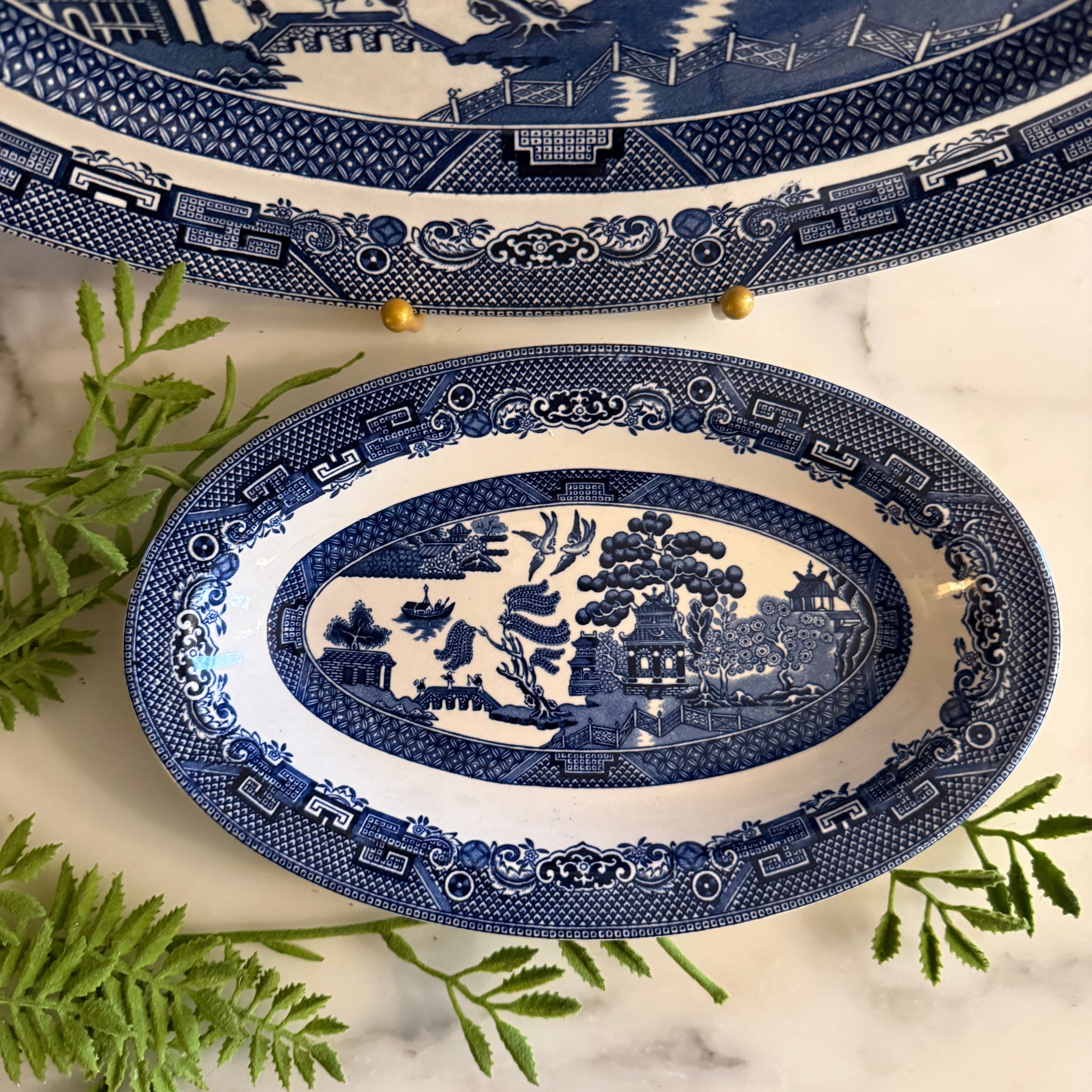 Close-up of the oval ironstone liner plate for the Blue Willow gravy boat.